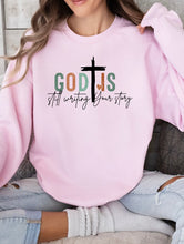 Load image into Gallery viewer, Cre8ed2luv&#39;s God is Still Writing Your Story graphic Sweatshirt